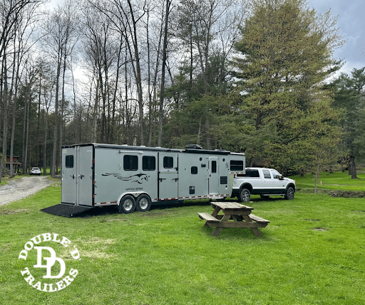 A Double D Trailers SafeTack Reverse Living Quarters model hitched to a tow vehicle.