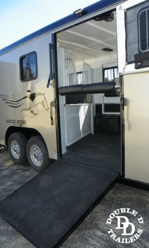 Side ramp of a horse trailer with a non-slip surface, designed for safe and easy loading and unloading of horses.