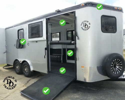 A bumper pull horse trailer with wide ramp, non-slip surface, and ventilation windows for horse safety.