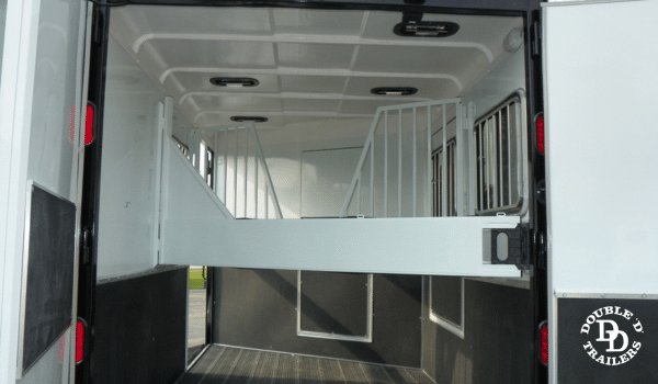 Tubular dividers in a horse trailer for safety, reducing confinement stress while allowing airflow and visibility