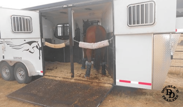 Reverse load configuration in a horse trailer to reduce stress and improve balance during transport.