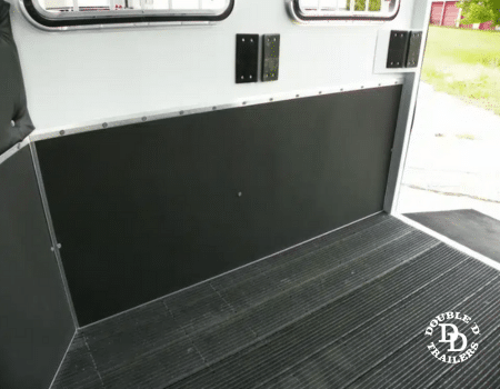 SafeKick Wall System in a horse trailer with durable composite material to absorb impact and reduce injury